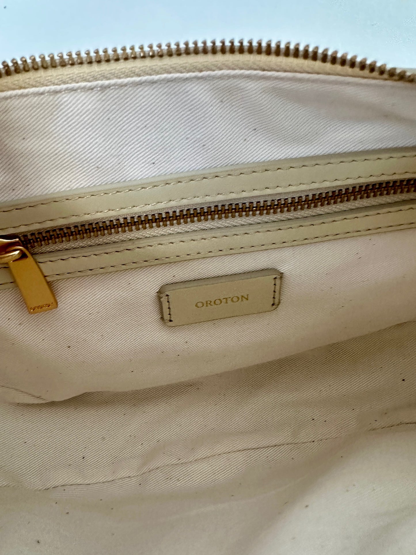 Oroton leather round shoulder bag in ecru