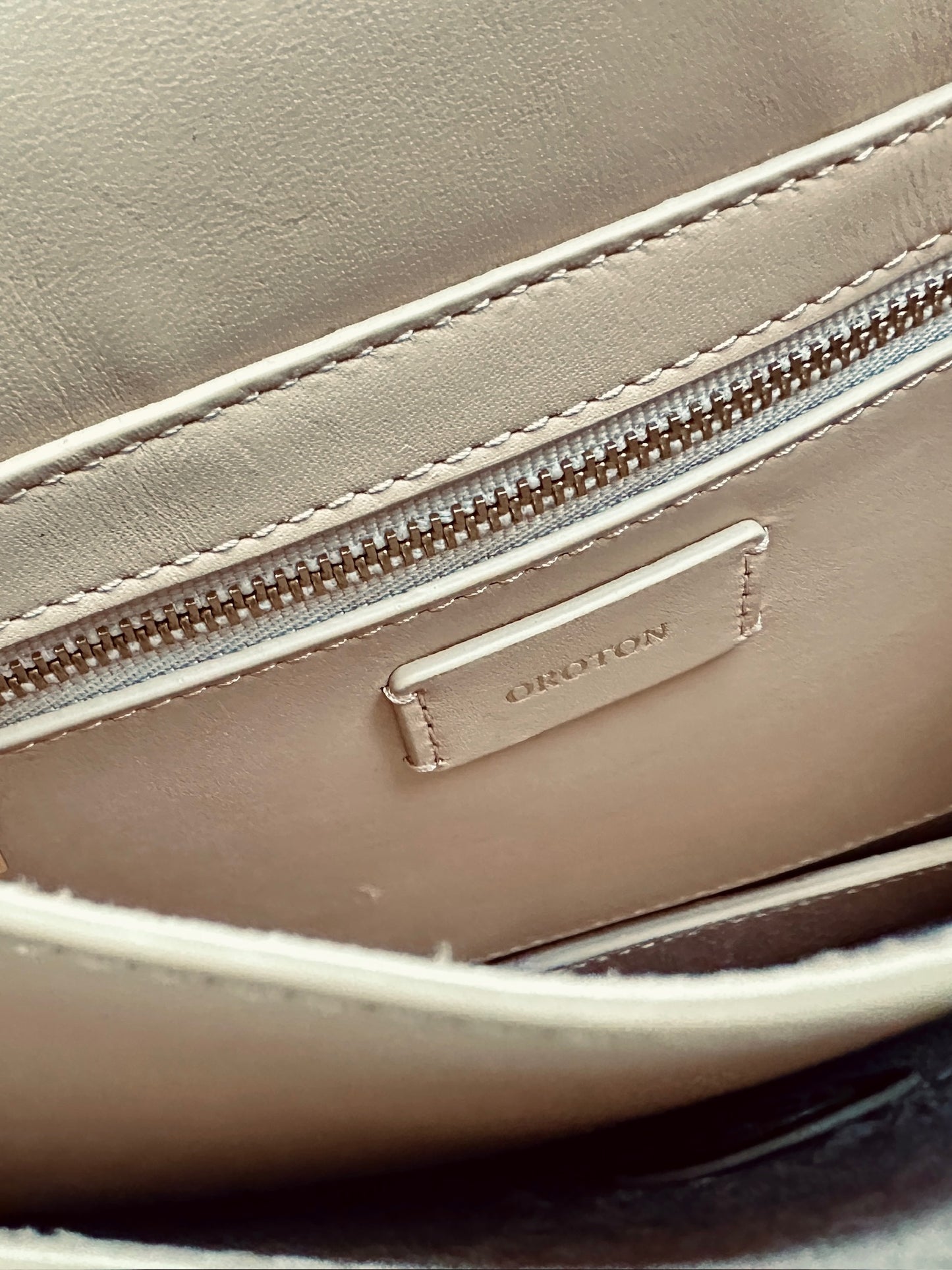 Oroton leather crossbody bag in caramel colour